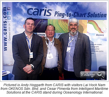 Pictured is Andy Hoggarth from CARIS with stand visitors Lai Hock Nam from OKENOS Sdn. Bhd. and Cesar Pimenta from Intelligent Maritime Solutions at the CARIS stand during Oceanology International.